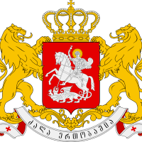 Georgian coat of arms. Two gold lions standing on hind legs, either side of red crest emblazoned with warrior on horseback.